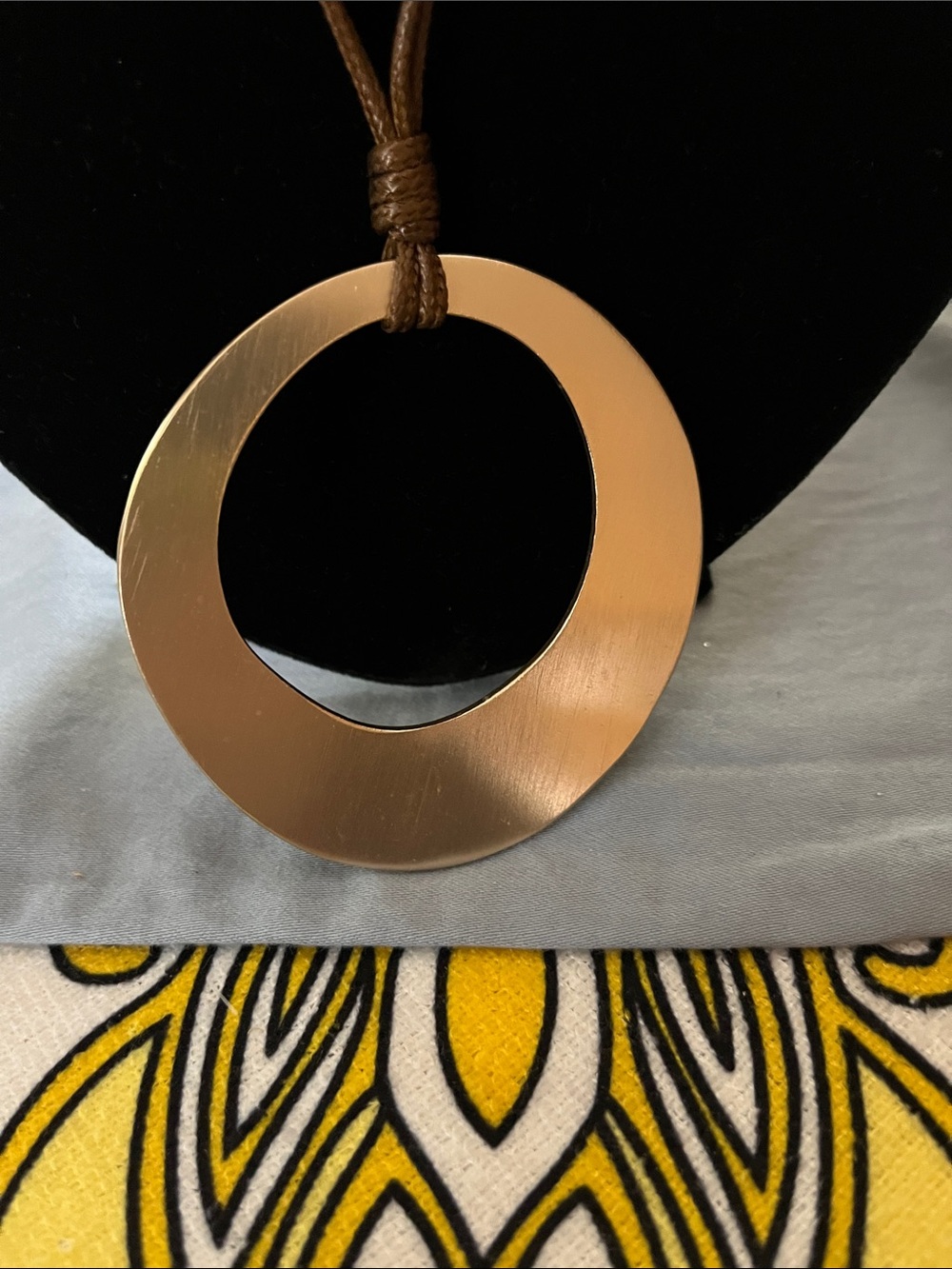 #56 Round Gold-Tone Pendant Necklace on Brown Leather Cord